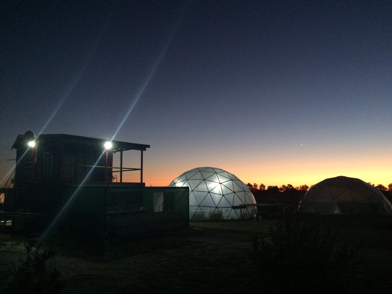 Fish growout domes at night